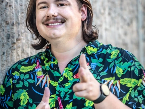 Joey Balke smiles and points at the camera 