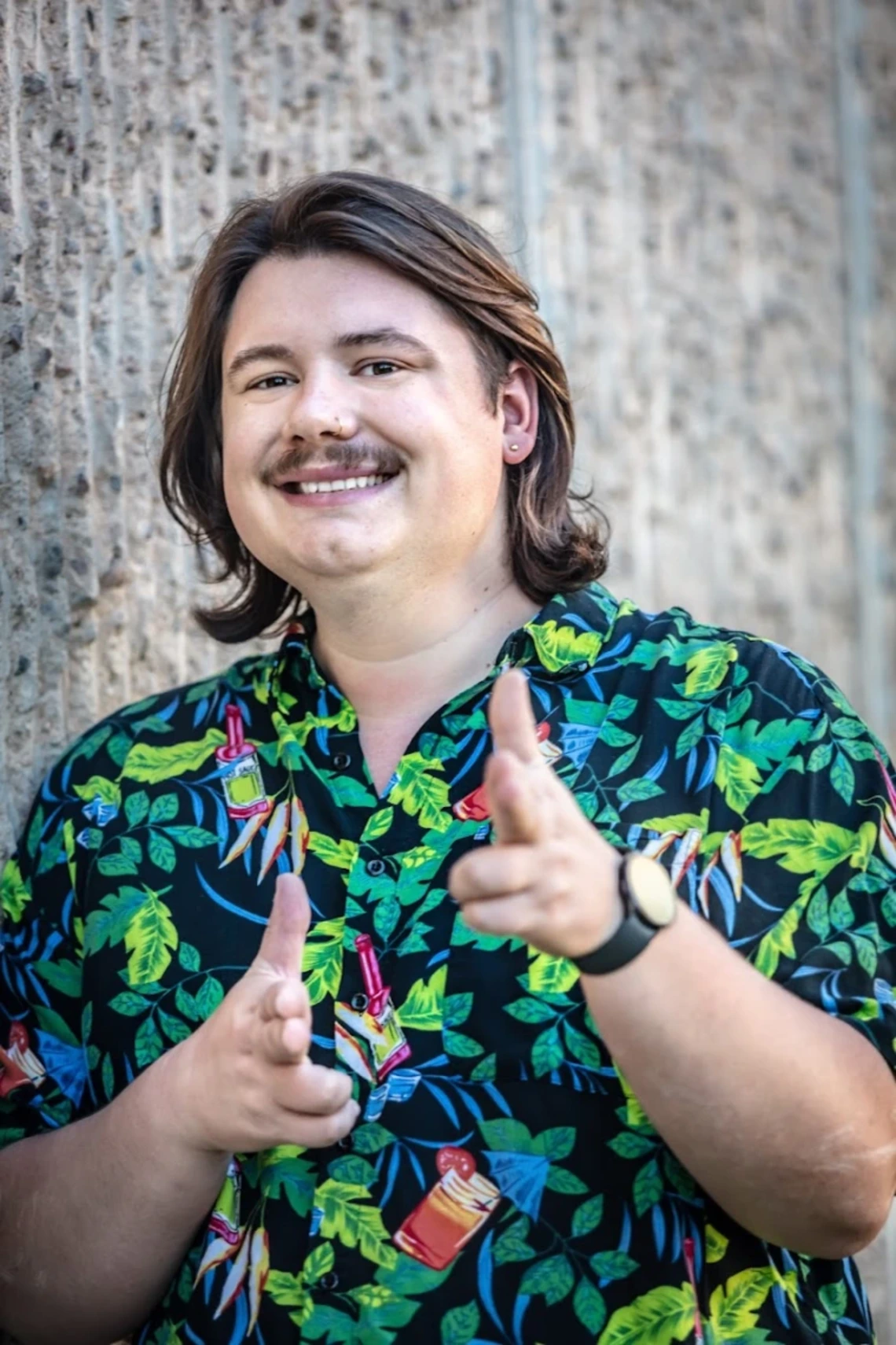 Joey Balke smiles and points at the camera
