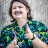Joey Balke smiles and points at the camera 
